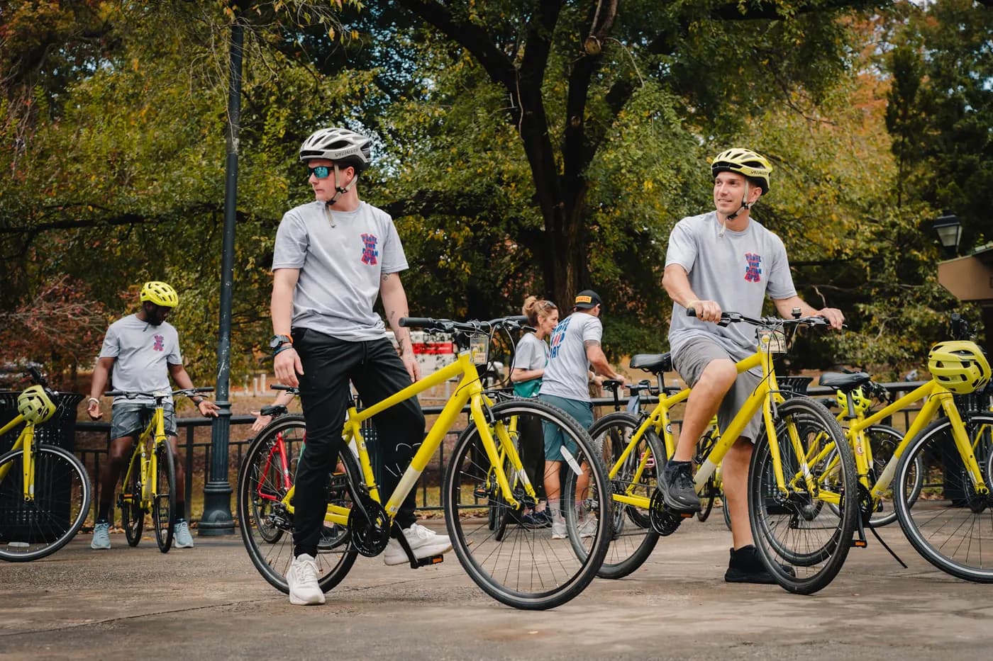 Helmeted cyclists gather with their bicycles before the 2025 ride.