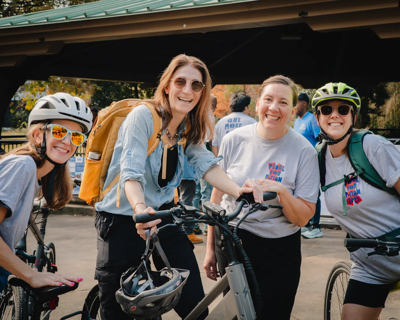 Smiling participants pose with bicycles at the 2025 Pedal for P-Man.